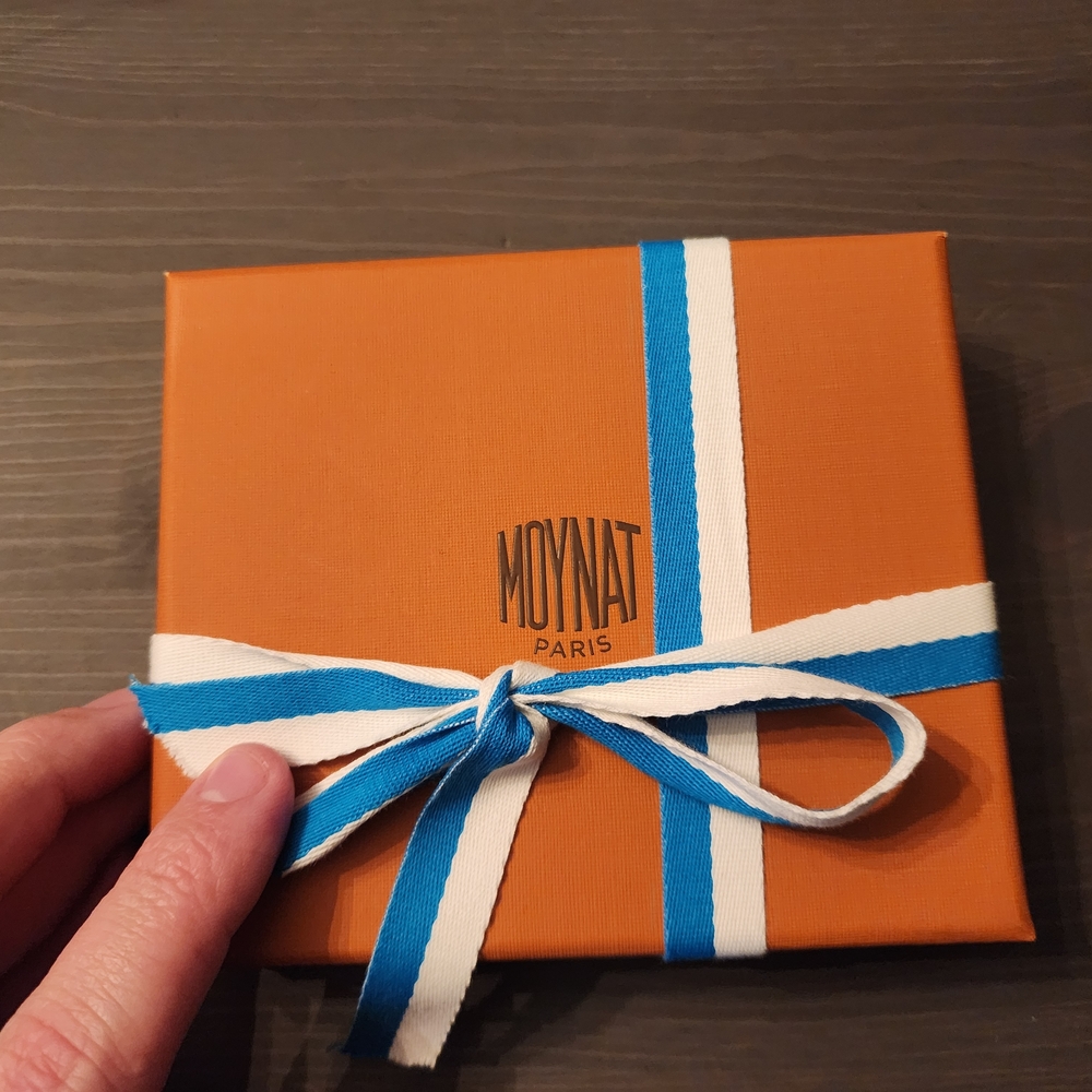 Orange Gift Box with Blue and White Ribbon